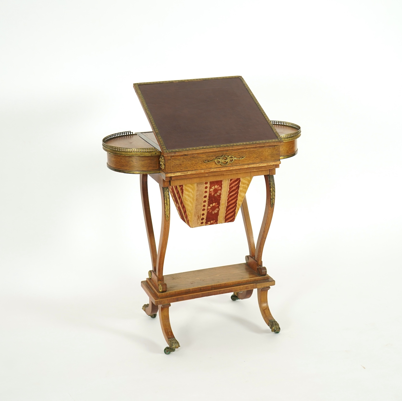 A Regency brass mounted rosewood writing, games and work table